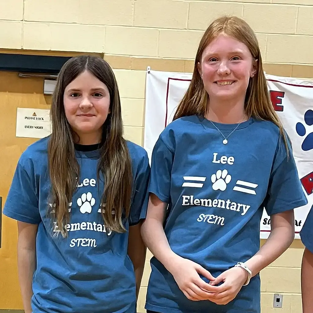 Two elementary school girls at an after-school STEM competition